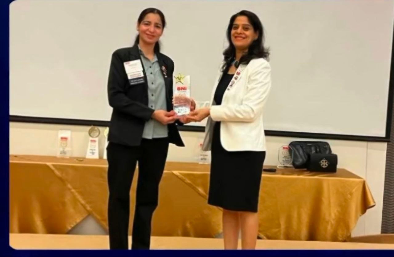 Balwinder Kaur receiving recognition at a professional event